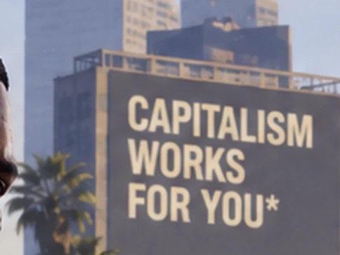 A billboard reading CAPITALISM WORKS FOR YOU with an asterisk and the fine print TERMS APPLY.